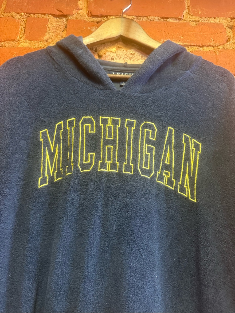 League Black Hoodie with Gold Logo
